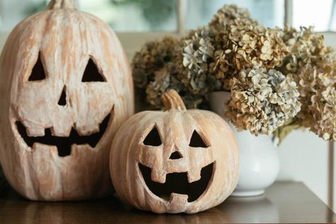 How To Make a DIY Terra-Cotta Pumpkin Jack O'-Lantern | HGTV Terra Cotta Pumpkins, Pottery Barn Diy, Spray Paint Crafts, Halloween Lawn, Fall Pumpkin Crafts, Plastic Pumpkins, Thanksgiving Decorations Diy, Pumpkin Carving Templates, Pumpkin Jack