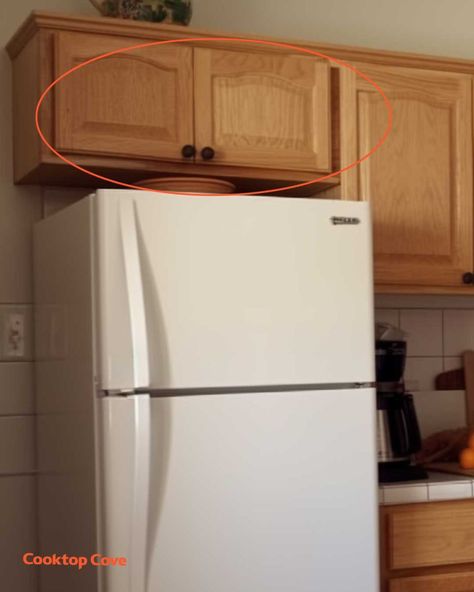 Most people think these cupboards are pointless. Here's how to properly use them How To Arrange Kitchen Cupboards, Above Fridge Cabinet Organization, Over Fridge Cabinet Organization, Open Cupboard Above Fridge, Cabinets Above Refrigerator Ideas, Top Of Cupboard Storage, What To Store In Cabinet Above Fridge, Beside The Fridge Storage, Kitchen Cupboards Without Doors