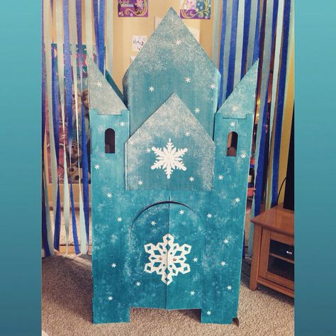 This was a fun Frozen party project for me and my daughters! A homemade Elsa's Castle out of cardboard, metallic paint, glitter, and a little imagination! It looks ice-tastic! Elsa Castle Cardboard, Frozen Castle Cardboard, Diy Wood Coat Rack, Diy Frozen Castle, Elsa's Castle, Dollhouse Painting, Elsa Castle, Castle Dollhouse, Frozen Diy