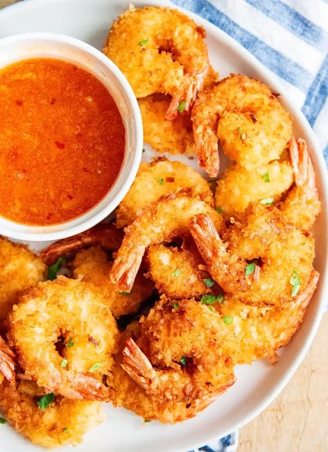 This coconut shrimp recipe is the best of the best. It tastes so much better than you'll get from any restaurant with the perfect crunchy, golden, coconut coated shrimp. It will be the first thing to go off the plate!