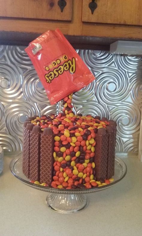 Reeses Pieces Buttercream cake with Nutty Buddy, peanut butter cup and reeses pieces Reeses Pieces Cake Birthdays, Reeses Cake Decoration, Reeses Birthday Party Theme, Reese Pieces Cake, Reese’s Pieces Cake, Reeses Cakes, Nutty Buddy Cake, Reeses Birthday Cake, Reeses Pieces Cake