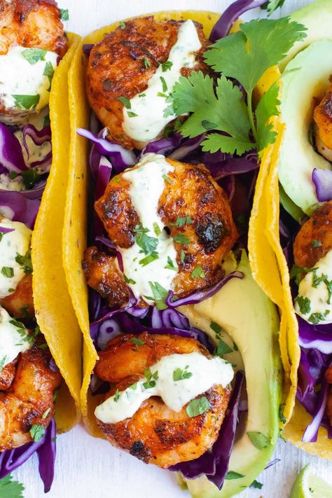 In under 30 minutes you can make up this easy Blackened Shrimp Tacos recipe! Spicy cajun seasoned shrimp are folded in toasted corn tortillas and topped with the best cilantro lime cream sauce. Make up these healthy and gluten-free tacos for a quick dinner on a busy weeknight. Quick Taco Recipes, Cilantro Lime Cream Sauce, Cilantro Lime Cream, Lime Cream Sauce, Blackened Shrimp Tacos, Easy Taco Recipe, Shrimp Taco Sauce, Easy Shrimp Tacos, Gf Df Meals