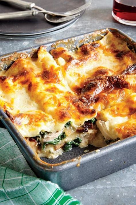 Chicken, Spinach, and Mushroom Lasagna | "Chicken thighs poach until tender in stock, which becomes the base for a creamy béchamel sauce. No-boil noodles absorb more liquid during baking for a sturdy slice after freezing and reheating." Spinach And Mushroom Lasagna, Chicken Spinach Mushroom, Lasagna Chicken, Spinach Mushroom Lasagna, Mushroom Lasagna, Béchamel Sauce, Spinach And Mushroom, Chicken Spinach, Chicken Lasagna