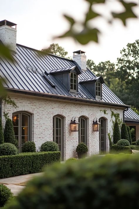 Effortlessly Chic: 40 French Country Homes You’ll Want to Move Into | VIVA Modern French Provincial Exterior, Brick French Country Exterior, Modern French House Exterior, French Acadian Style Homes, Modern French Style Home, Modern French Country Exterior, French Country House Exterior, Stone And Brick Exterior, French Garage