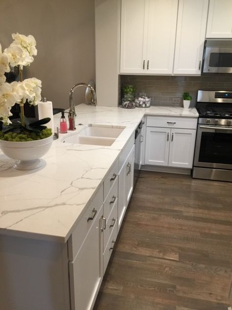 Calacatta Laza Quartz Kitchen, Gray Wood Floors, Quartz Kitchen Countertops White, Calacatta Laza, Backsplash For White Cabinets, White Kitchen Countertops, Quartz Backsplash, Marble Subway Tiles, Floating Shelves Kitchen