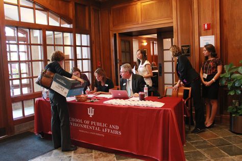 An employer checks in at the registration table. Check In Table Event, Registration Table, Checks