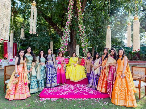 Customized Banarasi Lehengas For The Bridesmaids  #bridesmaids #lehenga #bridesmaids #bridal #bridesmaidoutfit #banarasi #banarasilehenga #bridesmaidstyle Banarasee Lehenga, Mehndi Inspiration, Mehndi Function, Wedding Outfits For Family Members, Wedding Captions For Instagram, Wedding Captions, Bridesmaid Photoshoot, Bridal Squad, Squad Photos