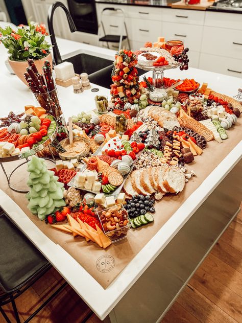 Christmas Charcuterie for a Jolly Holiday Dinner | Ozark Charcuterie | Enjoy a Christmas-themed charcuterie spread at your Holiday Dinner! Create a cozy and festive atmosphere for your gathering with tasty charcuterie boards, perfect for sharing during this merry season. Charcuterie provides a delicious and adorable feast for family and friends to enjoy. #charcuterie #charcuterieboard #grazetable #charcuteriecup #smallbusiness #christmascharcuterie #christmas Christmas Charcuterie Spread, Charcuterie Island Spread, Christmas Spread Table, Grazing Table Ideas Christmas, Christmas Charcuterie Table, Charcuterie Labels, Winter Charcuterie Board, Christmas Grazing Table, Holiday Charcuterie Board Ideas