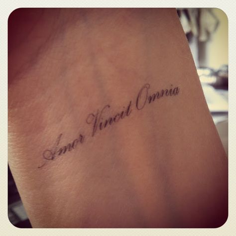 Amor Vincit Omnia (Love Conquers All- in Latin) Wrist Tattoo Amor Vincit Omnia Tattoo, Latin Quote Tattoos, Latin Tattoo, Disney Tattoo, Love Conquers All, Small Wrist Tattoos, Wrist Tattoo, Hip Tattoo, Trendy Tattoos