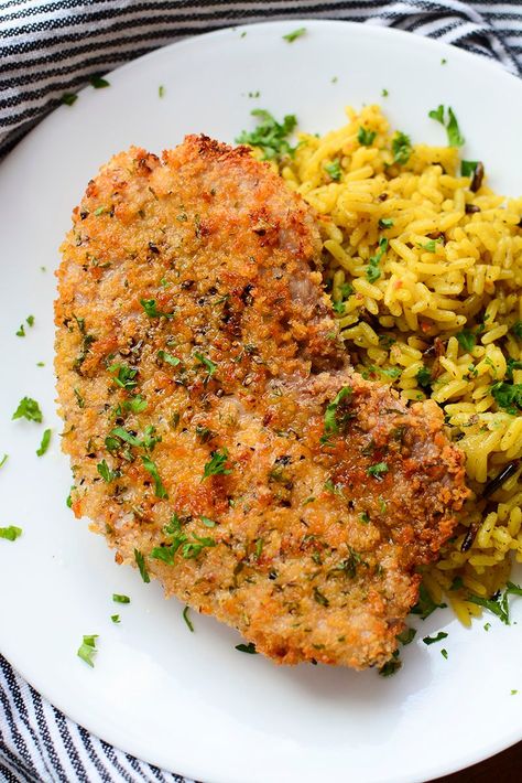 An air fried pork steak on a white plate with seasoned rice next to it. Airfryer Pork Steak, Cube Steak Seasoning, Pork Shoulder Steak Recipes Air Fryer, Pork Cube Steak Recipes Air Fryer, Pork Steaks In Air Fryer, Pork Steak In Air Fryer, Cubed Pork Steak Recipes, Air Fryer Pork Steaks, Pork Cube Steak Recipes