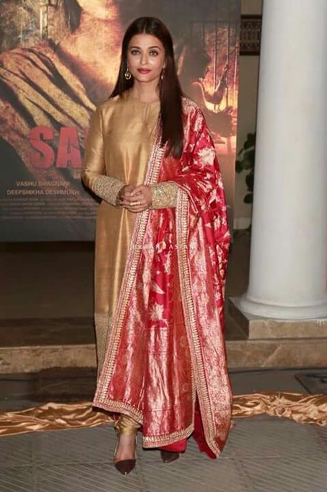 Aishwarya looks beautiful in golden n red dress Sabyasachi Dresses, Golden Suit, Indian Kurti Designs, Indian Designer Suits, Casual Indian Fashion, Kurti Designs Party Wear, Dress Indian Style, Stylish Dresses For Girls, Aishwarya Rai