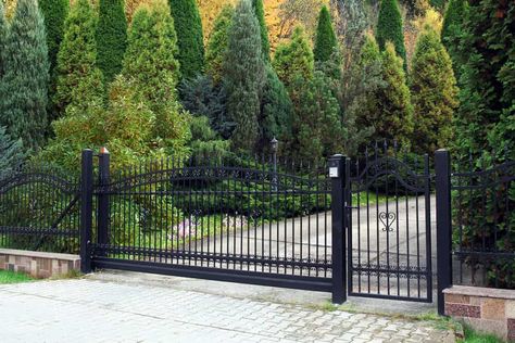 This wrought iron gate adds an sophisticated entry point for an car or pedestrian. Gard Modern, Electric Gate, Glass Fence, Garden Fence Panels, Cheap Fence, Front Fence, Brick Fence, Horizontal Fence, Types Of Fences