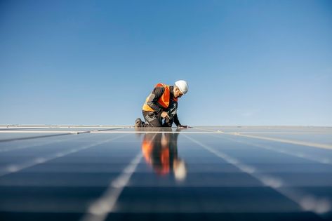 Photo worker kneeling and sets solar pan... | Premium Photo #Freepik #photo #photovoltaic #solar-panel #paneles-solares #solar Solar Panel Photography, Photo Moodboard, Sun Panels, Panel Solar, Ganpati Decoration, Solar Installation, Energy Management, Electrical Energy, Image Bank