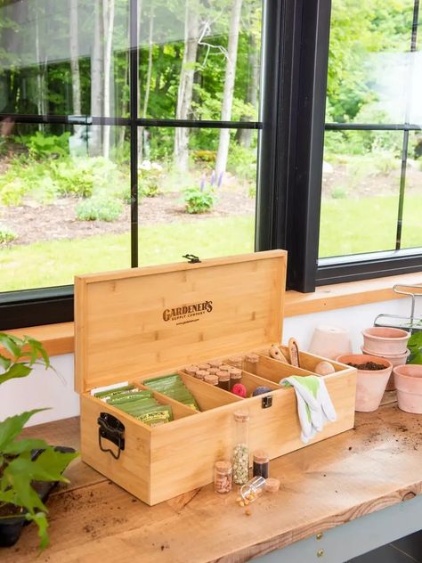 Bamboo Seed Saver Kit full of seeds on a work bench in a house