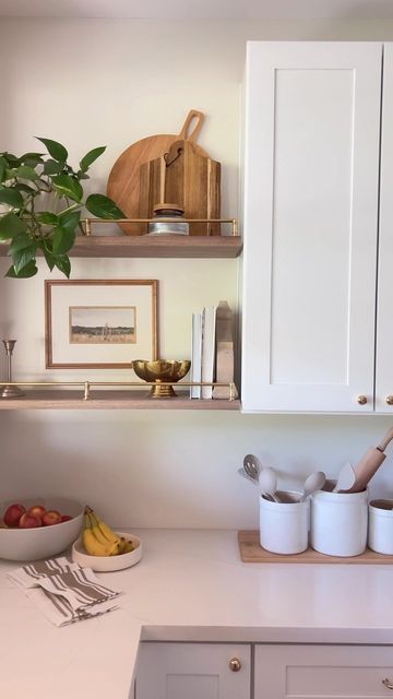 Kristi + Kelli ⌂ Lolly Jane on Instagram: "The floating shelves are finally complete! The cherry on top are these pretty brass rails ✨ Comment link and we’ll send them straight to your DM 💌 I thought this project would cause a divorce…it wasn’t as easy as it looks in this short video so head to our Kitchen Shelves highlight to see our BTS frustrations 😜 All in a DIY’s day work, amiright? Next up: drip rail under the sink 😍😍 This kitchen is nearly done! What’re you working on this week?" Kitchen Shelf With Railing, Floating Shelves With Railing, Gallery Rail Kitchen Shelf, Floating Shelves With Brass Rail, Kitchen Shelves With Brass Rail, Shelves Above Kitchen Sink, Floating Shelves Brass Rail, Open Wood Shelves Kitchen Brass Holders, Wood Shelf With Brass Rail