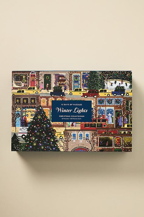 Unwrap the season with our Holiday 2024 collection, where magic meets merriment. Celebrate the 12 Days of Christmas with the Joy Laforme Winter Lights 12 Days of Puzzles Christmas Countdown, a delightful set that includes twelve 80-piece mini puzzles showcasing winter city scenes inspired by Laforme’s popular Winter Lights 500-piece puzzle. | Joy Laforme Winter Lights 12 Days of Puzzles Christmas Countdown Advent Calendar by Anthropologie in Purple Custom Advent Calendar, 2024 Advent Calendar, Christmas Packaging Design Inspiration, Joy Laforme, Cool Advent Calendars, Anthropologie Christmas, Winter Lights, Affordable Christmas Decorations, Christmas Decor Trends