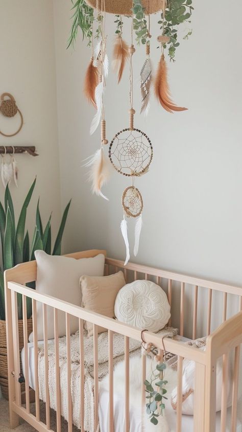 Serene nature-inspired nursery decor with wooden crib, plush toys, and dream catchers for peaceful baby sleep. Practical Magic Nursery, Tranquil Nursery, Nature Inspired Nursery, Wooden Crib, Wooden Cribs, Nursery Interior, Tender Moments, Soothing Baby, Daughters Room