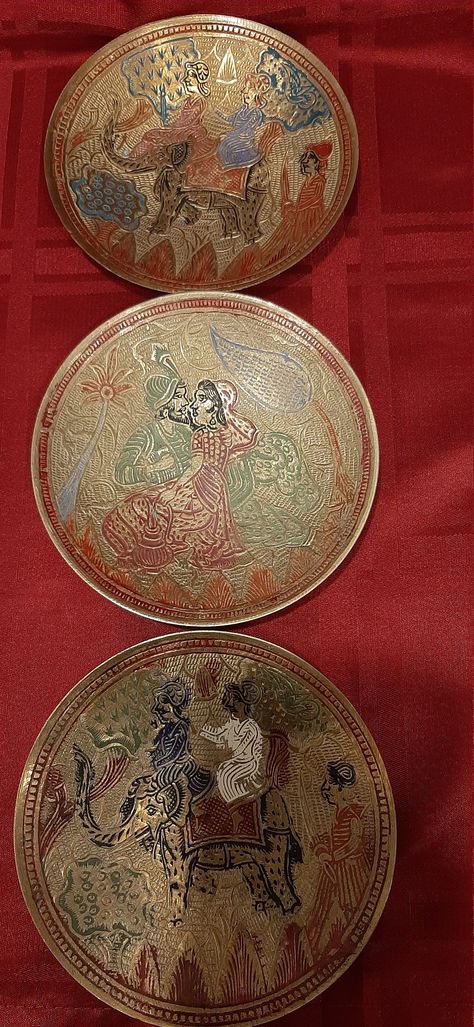 Vintage set of 3 handcrafted and colored enameled pattern solid brass wall mounted plates. Made in India. Circa 1930's. These hand made and hand engraved pattern brass decorative plates made by skilled craftsman in traditional Indian metal craft. The crafts of India are diverse, rich in history, culture and religion. The crafts in India reflect the influence of different empires. Throughout centuries, crafts have been embedded as a culture and tradition within rural communities. Metal craft incl Brass Plate Decor, Indian Serveware, Traditional Indian Decor, Silk Orchids Arrangements, Indian Brass, Fancy Print, The Crafts, Metal Craft, Plate Decor