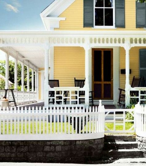 Country farmhouse Yellow Exterior House, House With Black Shutters, Farmhouse Exterior Colors, Yellow Exterior, Black Shutters, Exterior House Color, Exterior Paint Color, Yellow House, White Picket Fence