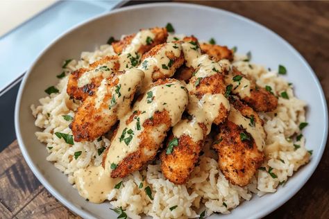 Tender chicken bites with creamy garlic parmesan rice make an easy and delicious dinner. Perfect for busy weeknights Chicken Bites And Rice, Garlic Parmesan Rice With Juicy Chicken Tenders, Chicken Tenders With Garlic Parmesan Rice, Garlic Butter Chicken And Rice Recipe, Garlic Butter Chicken With Parmesan Rice, Garlic Butter Chicken With Parmesan Cauliflower Rice, Chicken Bites, Creamy Garlic, Gluten Free Cheese