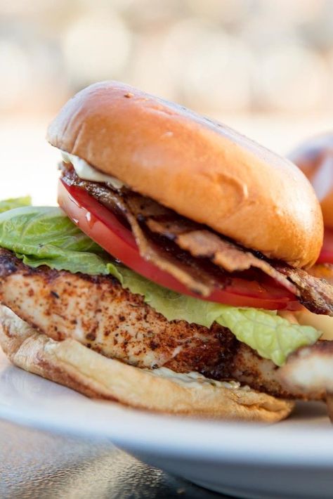 Grilled Blackened Fish Sandwiches | Seafood might not be your first choice for a cookout, but these blackened fish sandwiches flavored with paprika, oregano, thyme, onion and garlic powder, and cayenne are a guaranteed hit. In Florida blackened fish sandwiches are typically made with grouper, but any firm white fish will work.	  #longweekend #longweekendrecipes #longweekendinspo #seriouseats #recipes Super Bowl Sandwiches, Grouper Sandwich, Fish Sandwich Recipes, Fish Sandwiches, Homemade Slaw, Blackened Fish, Blacken Fish, Fish Fillets, Fish Sandwich