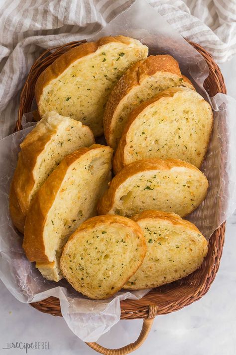 This homemade Garlic Bread is a classic side dish or appetizer that comes together in just 20 minutes! Sliced French bread is slathered with homemade garlic butter, then baked until soft, buttery, and golden-brown. #recipe #recipes | dinner ideas | bread | garlic butter | side dishes | easy recipes | easy dinner Recipes With Garlic Bread, Recipes With Garlic, Healthy Garlic Bread, Garlic Bread From Scratch, Garlic Butter For Bread, Homemade Garlic Butter, Make Garlic Bread, Homemade Garlic Bread, Garlic Bread Recipe