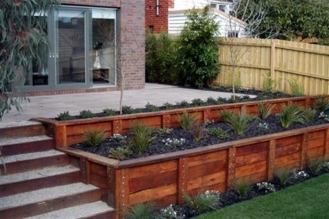 If your favorite outdoor space is your deck, we give you over 30 inspiring Deck Railing Ideas to show how you can spruce it up, from DIY to store bought. Wooden Retaining Wall, Spa Landscaping, Wood Retaining Wall, Sloped Yard, Sloped Backyard, Desain Lanskap, Outdoor Stuff, Swim Spa, Diy Deck