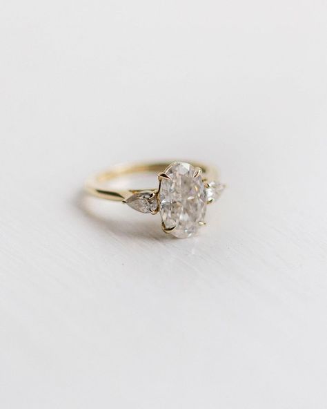 EAST WEST // GEM COMPANY on Instagram: “3 carat skinny oval with flanking pear size stones set in 14k yellow gold ✨ Love the flow of this three-stone ring…” East West Gem Company, Pear Cut Diamond Ring, Rose Gold Promise Ring, Oval Moissanite Ring, 3 Stone Ring, Moissanite Engagement Ring Oval, Yellow Gold Wedding Ring, Promise Ring Gift, Solid Gold Ring