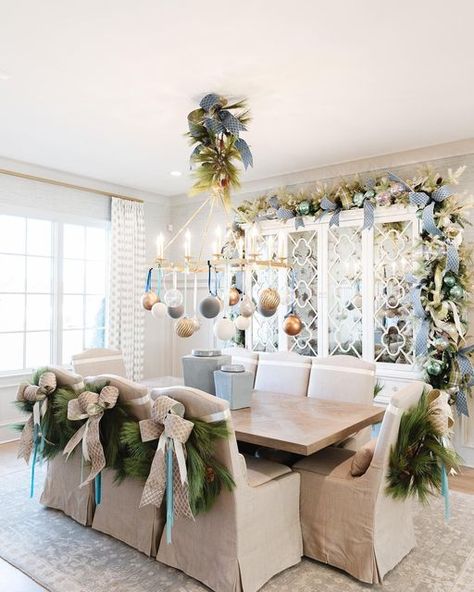 John Mark Sharpe on Instagram: "Merry Christmas from this fabulous dining room! Dress up your chairs with these pine wreaths and a simple bow! You can find them @johnmarkenterprises! Pictures by: @annabellacharles Interior Design by: @warehouse67design Home builder: @johndukehomes Realtor: @elizabethdukerealtor Home Show: @vestahomeshow Magazine: @athomemagazine" Christmas Dining Room Chair Decor, Christmas Wreath Dining Chairs, Pine Wreaths, Xmas Recipes, Simple Bow, Chair Bows, Christmas Chair, Christmas Eve Dinner, Christmas Dining Room