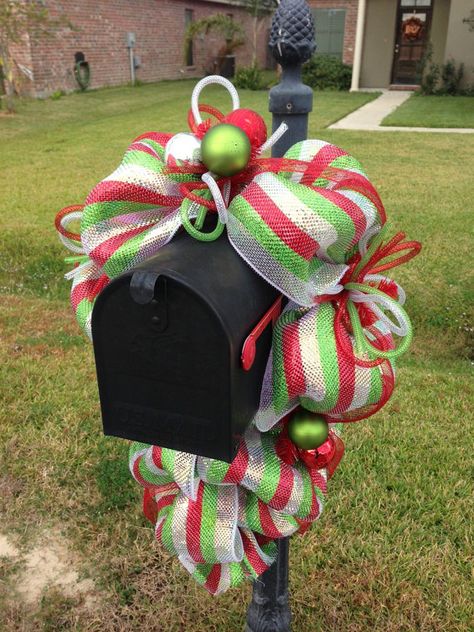 images of christmas mesh mailbox swags | This Christmas mailbox swag is made of premium red, white and green ... Christmas Mailbox Decorations, Mailbox Topper, Garland Mantle, Mailbox Swag, Mesh Garland, Christmas Mailbox, Mailbox Decor, Christmas Mail, Xmas Deco