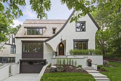 Tudor style cottage with a modern twist in historic Crocus Hill Modern Mediterranean Home, Scottish Cottages, Modern Tudor, Modern Mediterranean Homes, Cobblestone Street, Tudor Cottage, Beautiful Modern Homes, Private Backyard, Liberty House