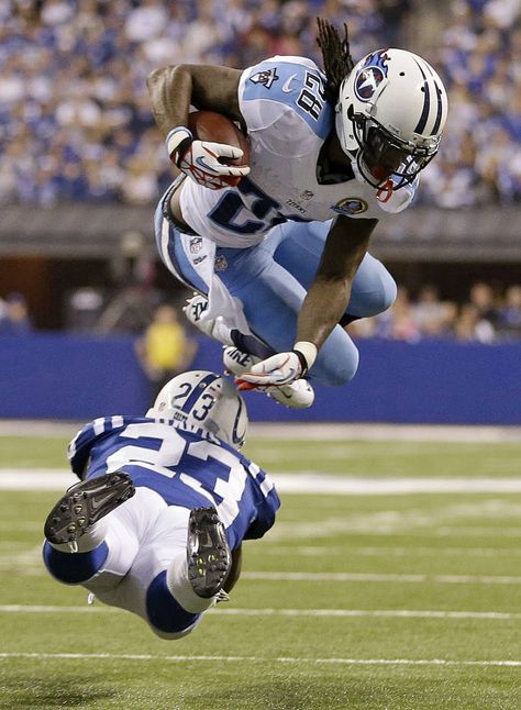 Chris Johnson attempts to avoid a tackle by Indianapolis Colts’ Vontae Davis last season (AP Photo/Jeff Roberson). We are looking forward to a great 2013/2014 season. Go Titans! Titans Football, Football Life, Chris Johnson, Nfl Season, Football Pictures, Sports Pictures, Tennessee Titans, Nfl Players, Sports Photos