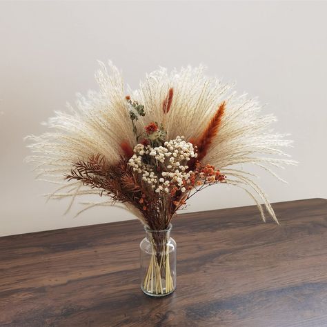 PRICES MAY VARY. A cute bouquet of dried flowers, to for so many different occasions,wedding,party,Birthday, mother's day, gifts, etc.Provide customized services! Bouquet size :17 inches long and 14-16 inches wide Vase Dimensions: 5.5" H, 3.5" W, Diameter: 2" Due to the nature of dried and preserved flowers please take extra care in handling. Some of the flowers are extremely fragile and delicate and shedding can easily occur. Something that is hard to avoid with dried stems,Our products will ar Desert Wedding Decor, Wedding Terracotta, Country Wedding Centerpieces, Wide Vase, Boho Wedding Centerpieces, Bouquet Centerpiece, Flower Boquet, Centerpiece Flower, Dried Flowers Bouquet