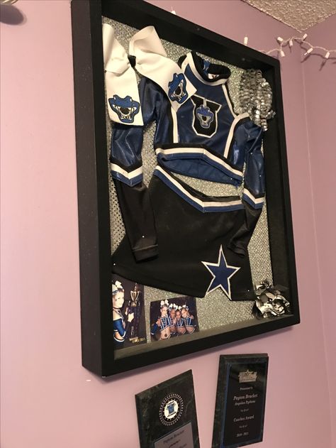 Cheer uniform display box Cheer Uniform Display Ideas, Framed Cheer Uniform, Cheer Trophy Display Ideas, Cheer Ring Display, Cheer Award Display Ideas, Cheer Display Ideas, Cheer Uniform Shadow Box Ideas, Uniform Display Ideas, Cheer Uniform Shadow Box