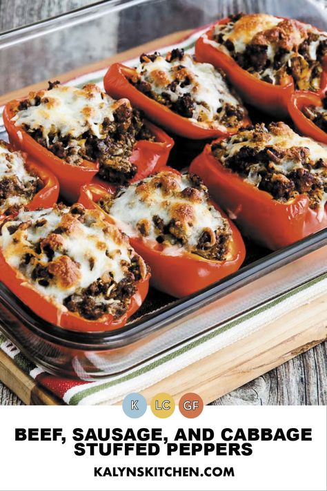 Pinterest image showing eight Beef, Sausage, and Cabbage Stuffed Red Pepper halves topped with cheese in a baking pan cooked and ready to serve. Sausage And Cabbage, Low Carb Stuffed Peppers, Stuffed Peppers Beef, Spicy Italian Sausage, Diet Lunch, Keto Stuffed Peppers, Low Carb Low Fat Recipes, Stuffed Pepper, Beef Sausage