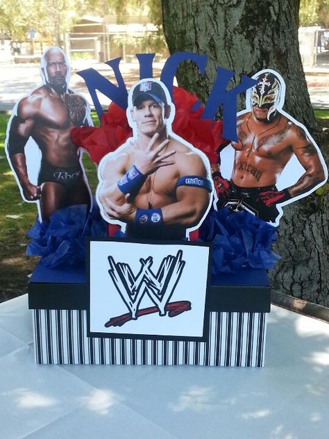 WWE party centerpice I made for my nephew's birthday party! Wwe Birthday Party Centerpiece, Wwe Centerpieces Ideas, John Cena Birthday, Wrestling Birthday Cakes, Wrestling Birthday Parties, Wrestling Party, Wrestling Birthday, Wwe Party, Wwe Birthday Party