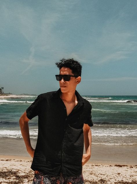 Black shirt, sunglasses, beach in the background, and pose. Beach Sunglasses Men, Beach Aesthetic Outfits, Shades For Men, Boys Sunglasses, Sunglasses Beach, Beach Shade, Beach Boy, Aesthetic Outfits Men, Memorial Weekend