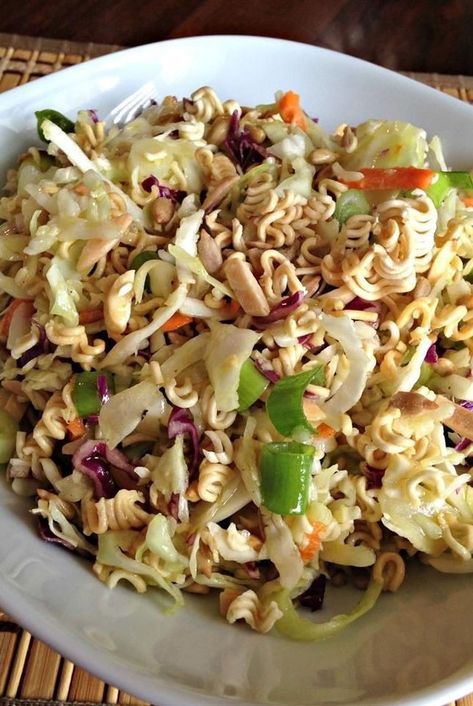 Looking for salad recipes? Try making this ramen salad. Use roman noodles, cabbage, almonds, and sunflower seeds to make this quick and easy ramen salad for a side dish, side salad, lunch, or dinner. #saladideas #saladrecipes #salads #vegetables #sidedishrecipes #sides #dinnersidedish #sidedishes #sidedishideas