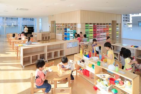 emmanuelle moureaux's kindergarten in japan uses shikiri to divide space using playful colors Kindergarten Interior, Daycare Design, Kindergarten Design, Wooden Architecture, Montessori Classroom, Nursery School, School Building, Chaise Design, Japan Design