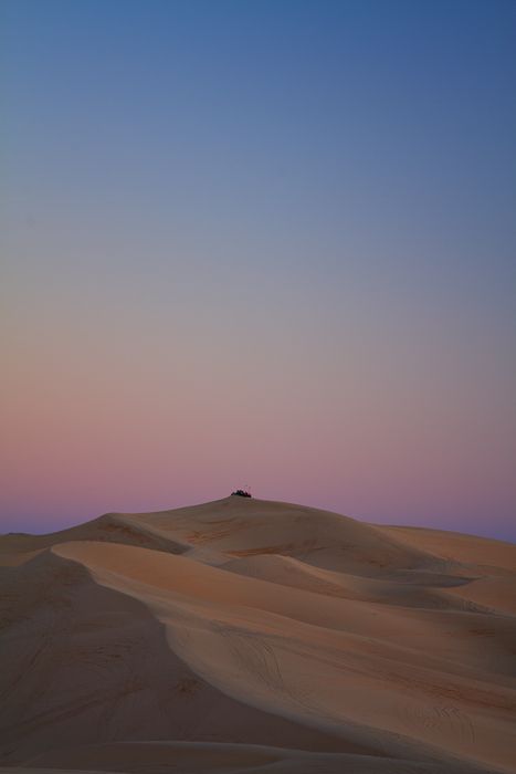 Sunset at Imperial Sand Dunes - I really like how the peacefulness of the evening sky contrasts with the excitement of being on the top of a dune ready to race down.  http://annemckinnell.com/2013/03/21/sunset-at-imperial-sand-dunes/ #photography #travel #california #sanddunes #blog Dunes Photography, Imperial Sand Dunes, Dunes Photoshoot, Iphone Paper, Industry Design, Ready To Race, Camping Trailers, Travel California, Twilight Sky