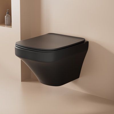 This matte black wall-mounted toilet stands out for its adjustable comfort, powerful flush, space optimization, easy to clean and modern design. Users can easily adjust the height of the seat to their personal preference and enjoy a comfortable experience. The powerful flush ensures a hygienic rinsing effect, while its compact design optimizes the use of space and makes it suitable for bathrooms of all sizes. Maintenance is very convenient, while the modernized appearance adds a stylish atmosphe Wall Hung Toilet Ideas, All Black Bathroom Ideas, Low Profile Toilet, All Black Bathroom, Upflush Toilet, Floating Toilet, Toilet Modern, Compact Toilet, Tankless Toilet