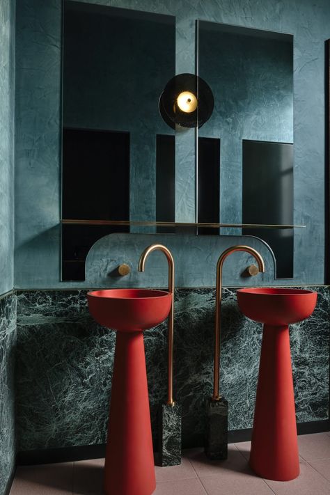 The bathrooms in Poodle Bar & Bistro are defined by the striking red sculpted basins, drawing the eye inwards and crafting a memorable visual experience. The unexpected injection of colour is combined with green marble, Roger Seller brushed gold fixtures and curved detailing. Interior Design & Styling: Berman & Co Build: LocBuild Custom Furniture & Lighting: Please Please Please Design Photography: Derek Swalwell #bathtub #bathroomwithaview #minimalism #minimal #house Teal Bathroom, Basin Design, Interior Design Awards, Toilet Design, Drinks Design, Big Bathrooms, Stylish Bathroom, Hospitality Design, Beautiful Bathrooms