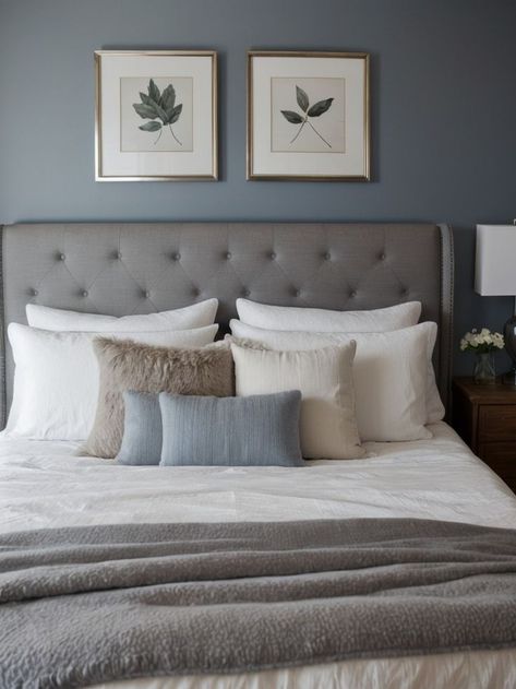 Create a serene and sophisticated bedroom by incorporating a blue-grey accent wall as the focal point. Pair it with a tufted upholstered bed, crisp white bedding, and metallic accents for a touch of elegance. Transform your bedroom into a tranquil oasis with a blue-grey accent wall. Complement it with natural wood furniture, such as a reclaimed wood dresser, and soft textures like a faux fur rug and knit throw pillows.. Navy Bedroom Walls, Powder Blue Bedroom, Reclaimed Wood Dresser, Soft Blue Walls, Record Decor, Grey Painted Walls, Blue Gray Bedroom, Blue Grey Walls, Airy Bedroom