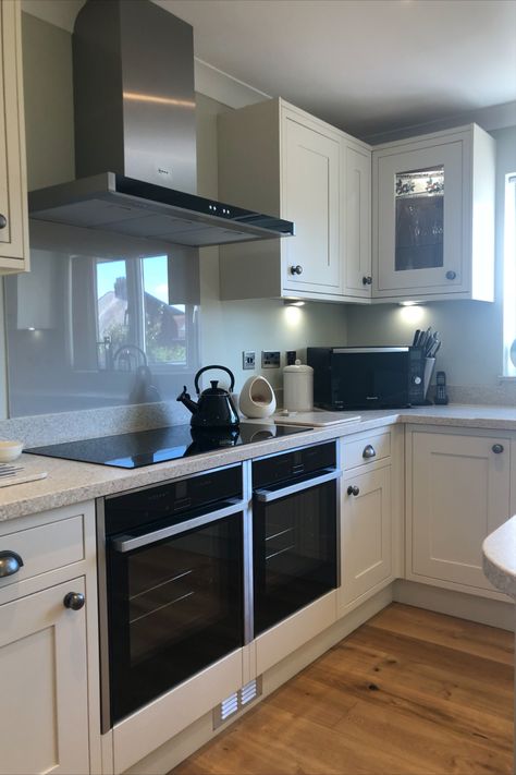 Looking for a kitchen with a more traditional, bespoke feel? 
In frame kitchens are a great choice for people that want that extra little touch of class to their new kitchen. Team with beautiful Corian Worktops,  ornate handles and rustic flooring for the perfect traditional look.
This client opted for Neff slide & hide ovens, a large induction hob, integral fridge/freezer and dishwasher. Slide And Hide Oven, Kitchen Mantle, Integrated Oven, White Shaker Kitchen, Kitchen Designer, Rustic Flooring, Cooker Hood, New Kitchen Designs, British Bake Off