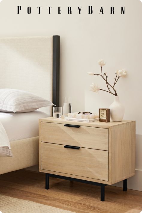 Elevate a minimalist look with quality pieces crafted to last. Complement light wood washes with warm textural elements like a woven rug and upholstered bed. Complete the look by pairing pops of black that ground the space for a modern feel. Black And Light Wood Nightstand, Light Brown Wood Furniture, Nightstand Light Wood, Black And Wood Nightstand, Dresser And Night Stand Ideas, Light Brown Bed Frame, Light Oak Bedroom, Night Stand Ideas, Side Table Wood Modern