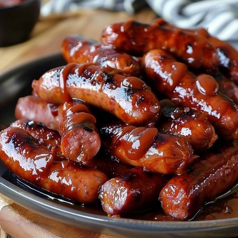 🔥 Mississippi Lil Smokies: Dive into the smoky goodness of these lil' treats at your next gathering! #SnackTime Mississippi Lil Smokies Ingredients: Lil smokies sausages (1 lb (450g)) Ketchup (1 cup (240ml)) Brown sugar (1/2 cup (100g)) Worcestershire sauce (2 tbsp (30ml)) Hot sauce (1 tsp (5ml)) Instructions: Combine all ingredients in a slow cooker. Cook on low for 4 hours. 🌭 Perfect party snack, guaranteed to disappear fast! #LilSmokiesLove Fast Food Appetizers, Lil Smokies, Happy Hour Food, Sausage Dishes, Party Snack, Food Babe, Trending Recipes, Sweet Snacks Recipes, Mouth Watering Food