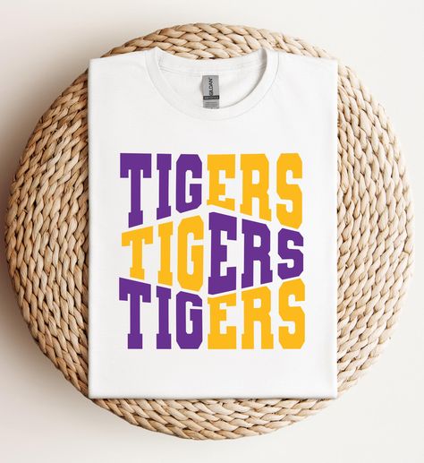 This T-Shirt is perfect for tailgating, game days or any casual occasion. It's a must-have for LSU fans and would make an excellent gift for family and friends. Geaux Tigers!    ➡️This is a DTF print (Direct to Film) heat pressed onto garment. ➡️T-shirt Brands: Gildan Soft Style, Hanes or Jerzee at this time.  ➡️Unisex Sizing - True to size, but for a trendy, oversized look, we recommend sizing up.  Please note: Colors in listings might vary slightly based on your device and print size may diffe Pep Squad, Lsu Tigers Logo, Lsu Fans, Go Tigers, Lsu Football, Geaux Tigers, Tiger Shirt, Cute Womens, Dtf Print