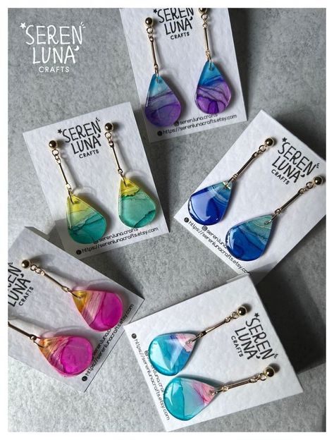 These elegant dangle teardrop earrings come with alcohol ink art patterns and beautifully blended colours. Each pair is a wearable art, featuring a unique design with vibrant, swirling hues encapsulated in a teardrop shape. The metal bar adds a touch of sophistication, drawing attention to the mesmerizing art pattern. Crafted from glossy resin, these earrings are perfect for any occasion--they're more than accessories; they're wearable works of art! Earrings are backed with in gold plated 304 st Resin Jewelry Diy, Resin Jewellery, Art Earrings, Art Patterns, Alcohol Ink Art, Jewellery Handmade, Jewelry Card, Earrings Small, Metal Bar