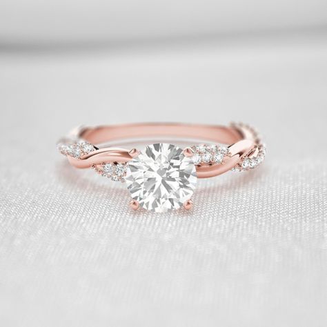 For anyone who wants timeless style with a point of difference, our Amelia diamond engagement ring is a quite literal twist on a classic… At its center, your choice of a beautiful diamond in the shape that you love is held in four classic claws. The band is where things get exciting, with a graceful twist design that brings a little texture and interest to the ring. The twisted band is accentuated by a sparkling row of diamonds, for an extra touch of luxury. The Amelia twist diamond engagement r Twisted Band Engagement Ring, Twist Engagement Ring, Rose Gold Engagement Ring Set, Square Engagement Rings, Engagement Rings Twisted, Twisted Metal, Colored Engagement Rings, Twisted Band, Engagement Rings Platinum