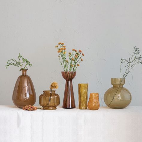 Our thoughtfully curated collection of vases showcases a wide array of silhouettes, textures, and hues designed to showcases seasonal flora, dried botanicals, faux fronds, or delicate blooms. Modern Glass Vases, Brown Vase, Branch Decor, Table Vase, Table Vases, Floor Vase, Vintage Vases, Modern Glass, Glass Candle Holders